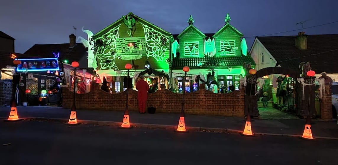 The full PlantationVille Haunted Manor frontage illuminated on Halloween night